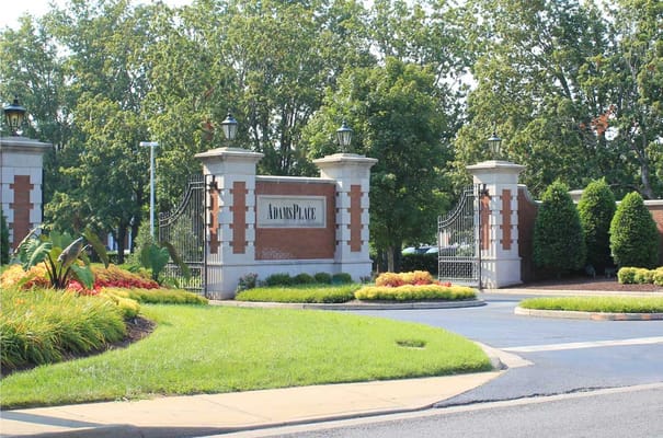 Entrance gate to AdamsPlace with landscaping