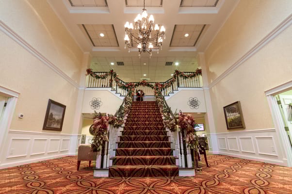 Interior view of a lobby with decorated staircase