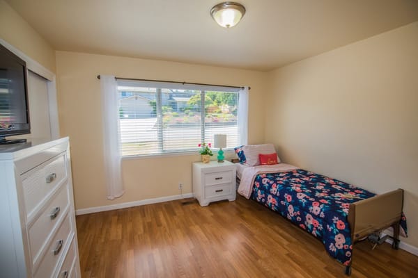 Cozy private room with a bed and window