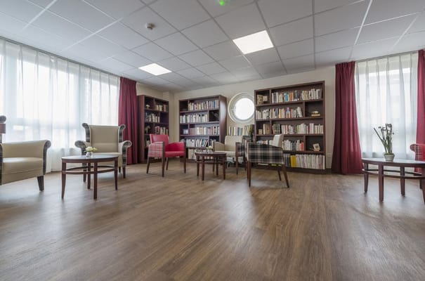 Bright common area with bookshelves and seating