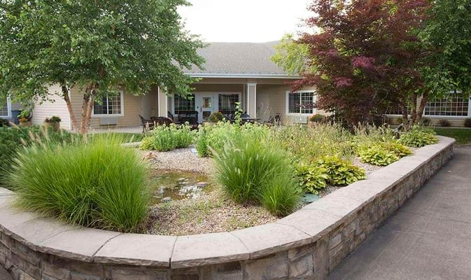 Outdoor garden with landscaping and seating area