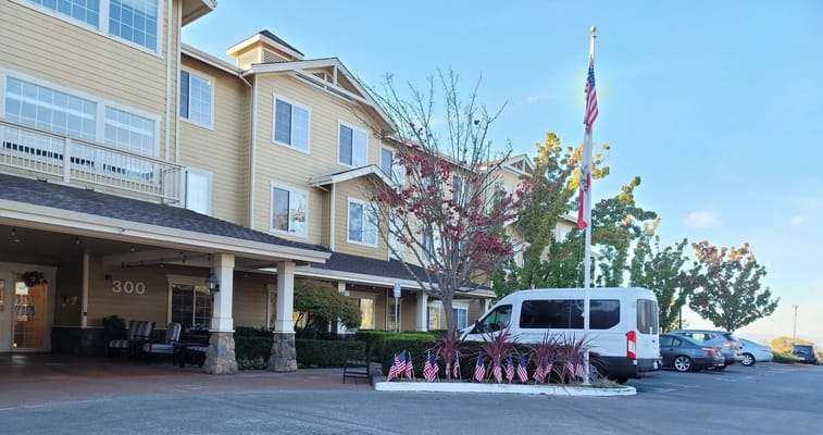 Exterior view of Arbol Residences with landscaping and van