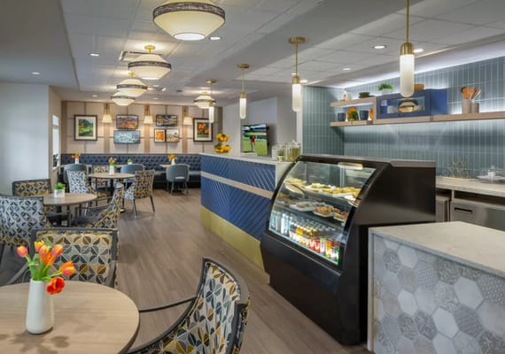 Bright dining area with modern decor and food display