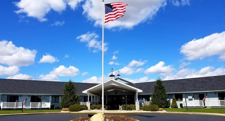 Exterior view of the facility with an American flag