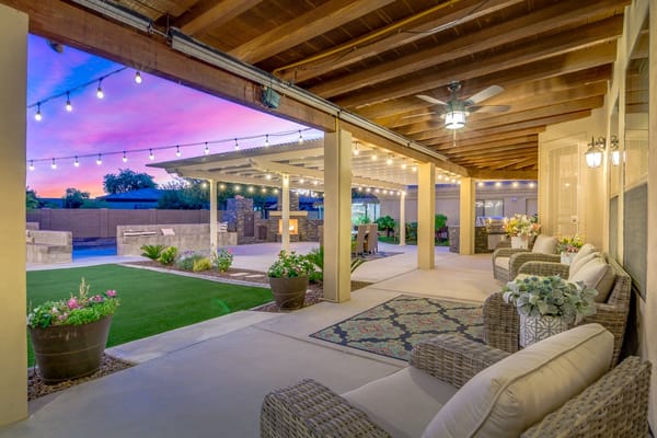 Outdoor patio area with seating and string lights
