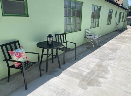 Outdoor seating area with chairs and table