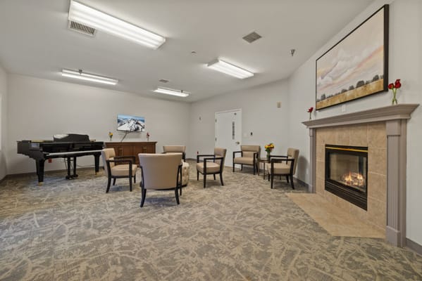 Interior common area with seating and a fireplace