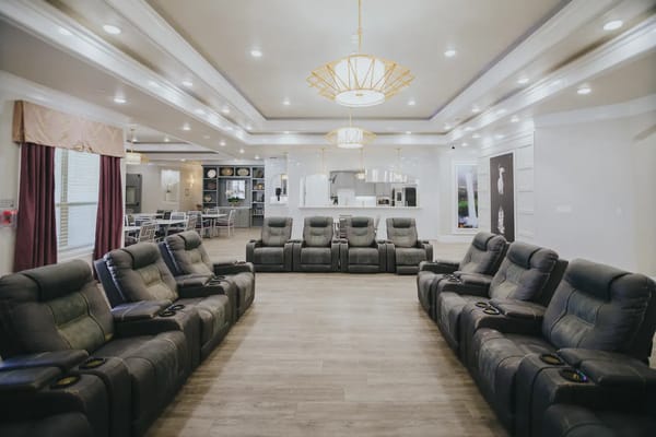 Spacious lounge with reclining chairs and modern decor