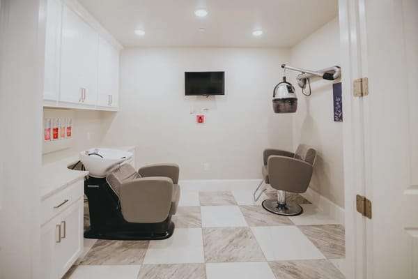 Hair salon with styling chairs and washing station
