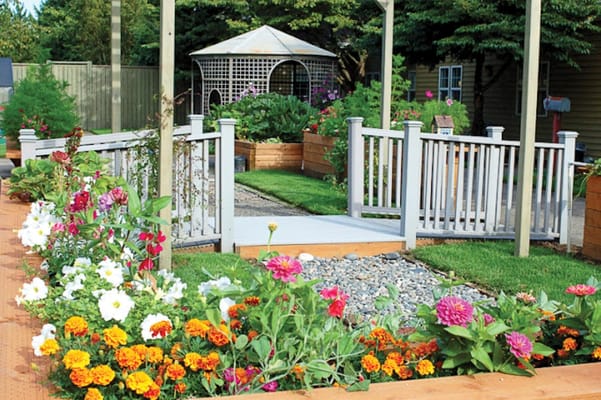 Beautifully landscaped outdoor space with flowers and pathway