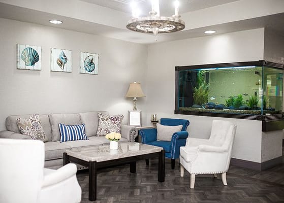 Comfortable common area with seating and aquarium