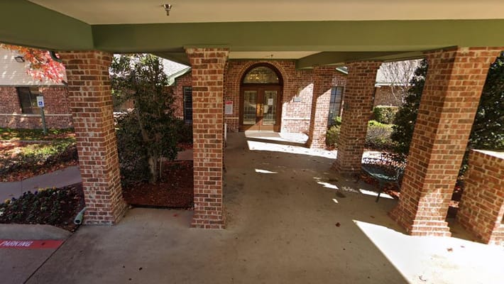 Entrance area of a senior care facility with brick columns