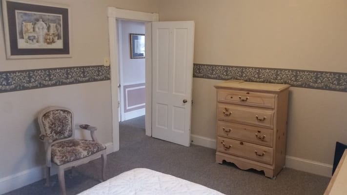 A simple bedroom interior with furniture