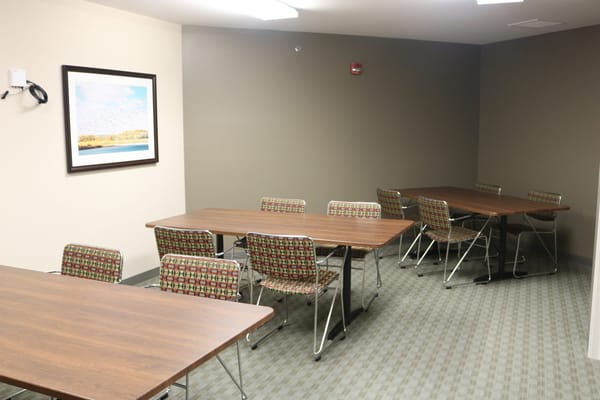 Interior view of a common area with tables and chairs