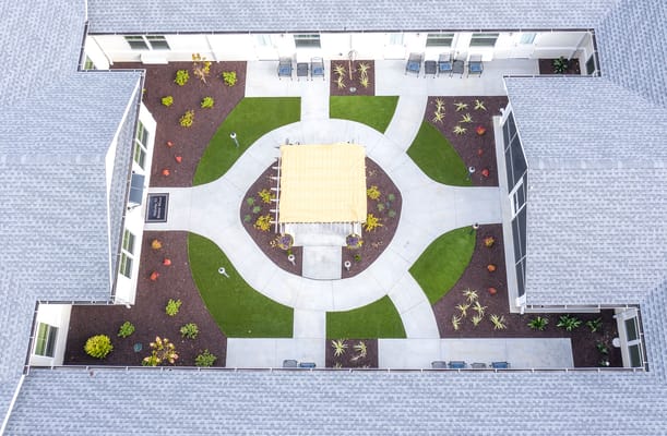 Aerial view of a landscaped courtyard with seating