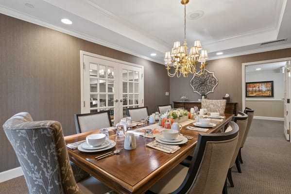 Elegant dining room setup with food and drink offerings