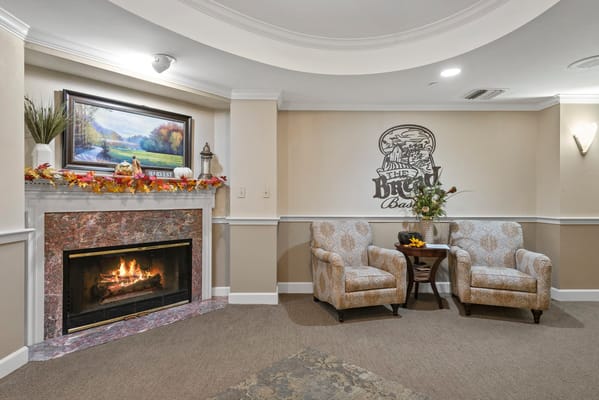 Cozy lounge area with a fireplace and seating