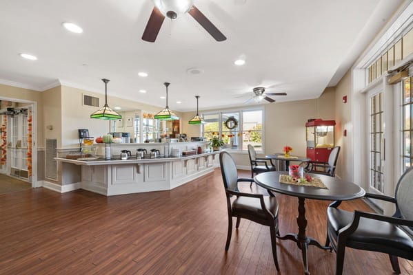 Bright dining area with tables and chairs