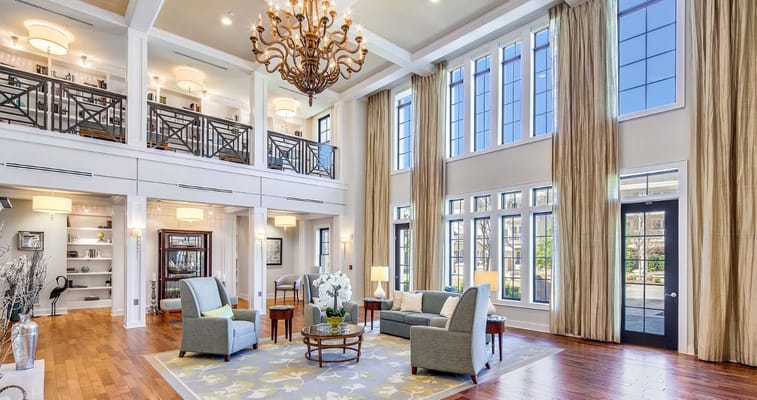 Bright common area with seating and large windows