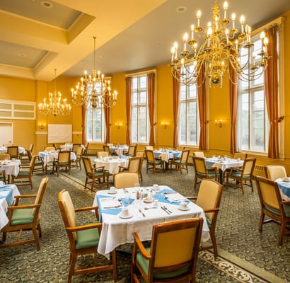 Elegant dining room with tables set for meals