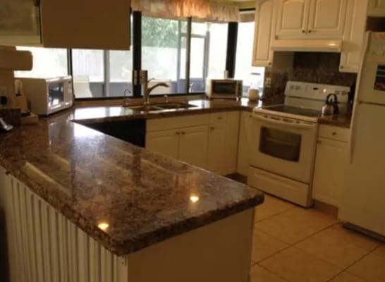 Bright Horizons of Ramblewood kitchen with granite countertops and appliances.