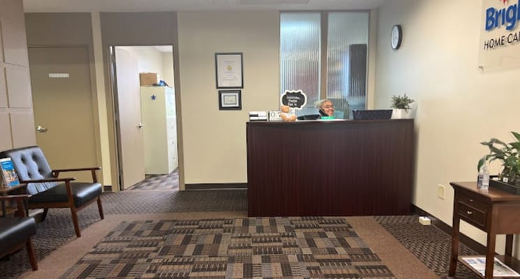 Reception area with staff member at the front desk