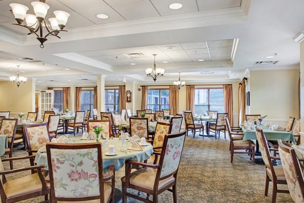Dining room with elegantly set tables and decor