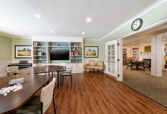 Bright and inviting common area with seating and shelves