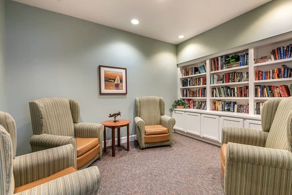 Cozy lounge area with comfortable chairs and bookshelves