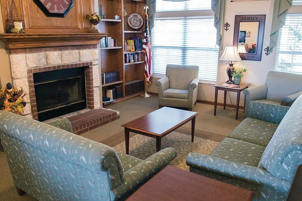 Cozy common area with seating and a fireplace