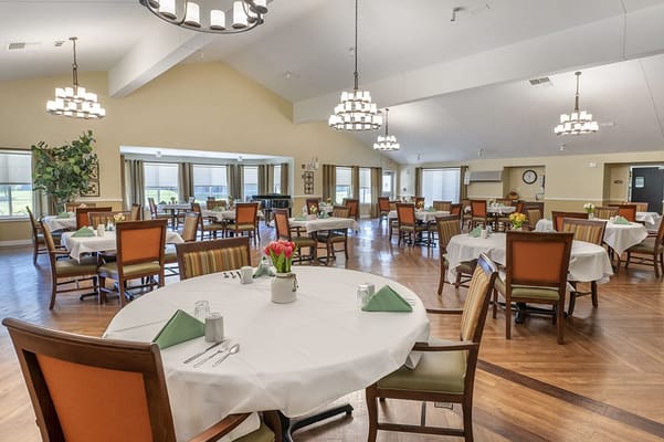 Dining area with tables set for residents