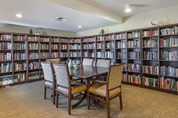 A cozy library with bookshelves and seating