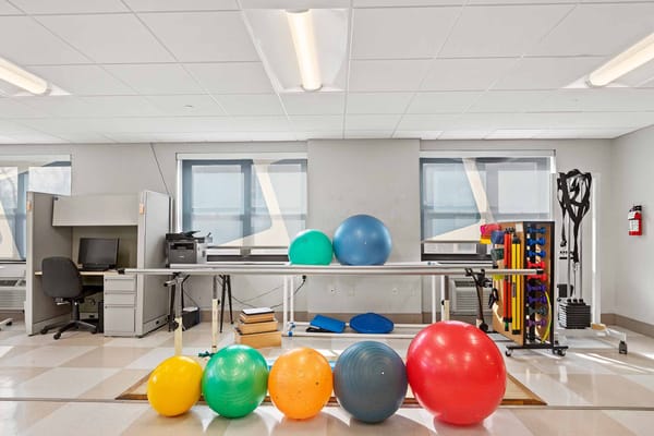 Rehabilitation room with therapy balls and equipment