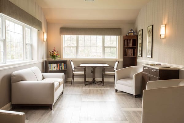 Bright common area with seating and natural light