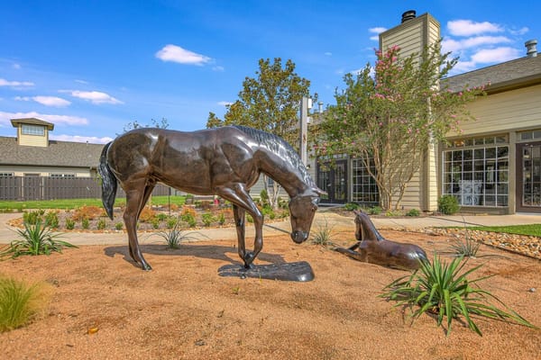 Bronze horse statue with a young horse in the garden of Cedar Crest Senior Living
