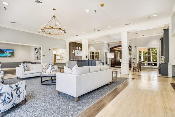 Spacious living room with comfortable seating and a decorative rug