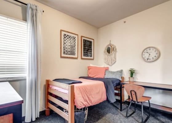 Cozy private resident room with bed and desk