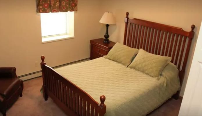 Cozy bedroom with a bed and lamp