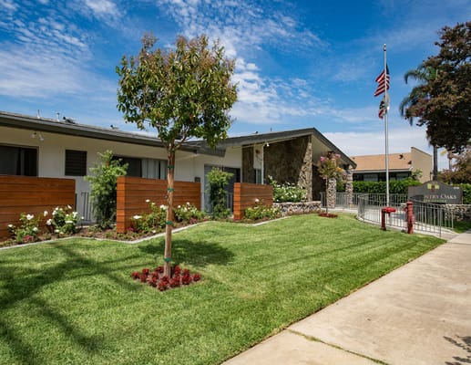 Exterior view of Country Oaks Care Center with landscaping
