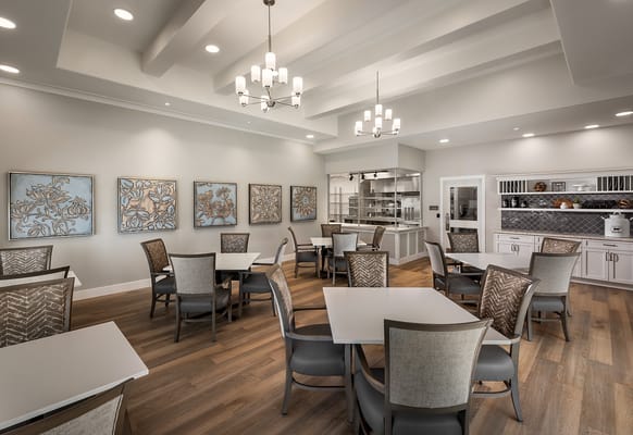 Bright dining room with tables and chairs arranged