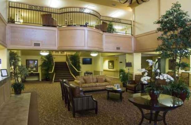 Spacious lobby with seating and decorative plants