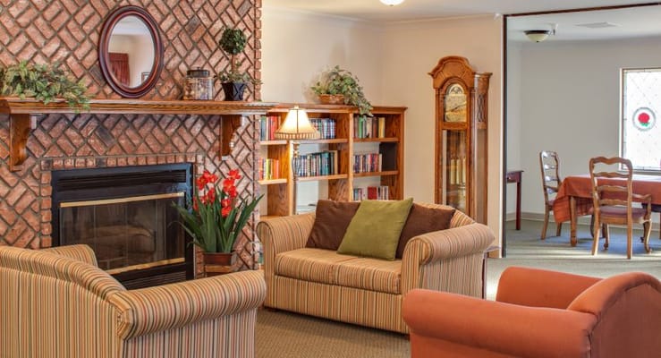 Cozy common area with seating and bookshelves