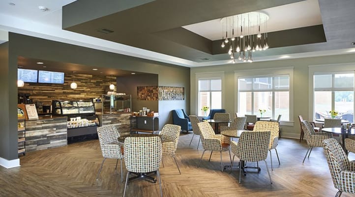 Interior view of the café with seating and a display case