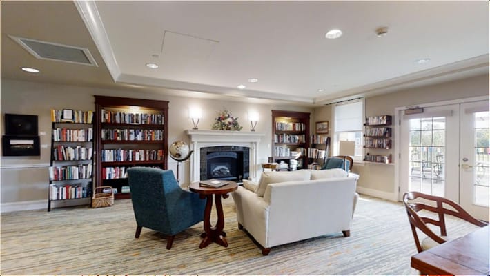 Cozy living room with bookshelves and seating area