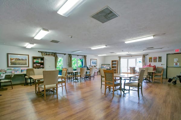 Spacious common area with tables and chairs