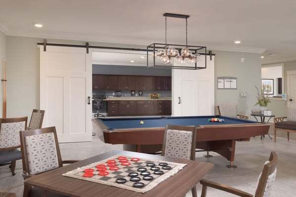 Activity room with a pool table and seating
