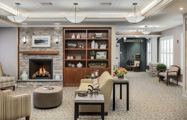 Inviting living room with a stone fireplace and comfortable seating