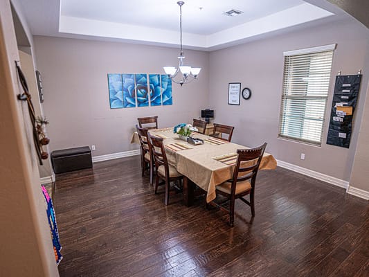Dining area with tables and chairs set for a meal