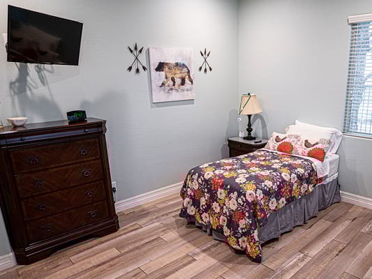 Cozy resident room with a bed and decor