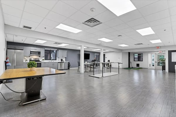 Bright, spacious common area with kitchen and seating
